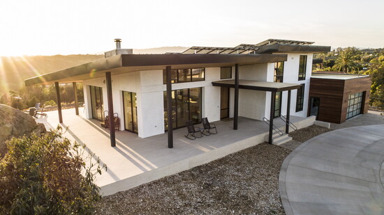 The modern architecture emphasizing the streamline roof and simple horizontal elements.