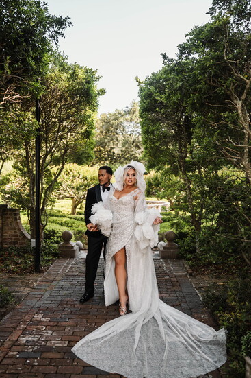 Photo by Brittany Coonrad @brittandbeanphotography Location- Elizabethan Gardens, Manteo NC Dress- Custom Milla Nova Cape- Milla Nova Tuxedo- Custom Suit Supply