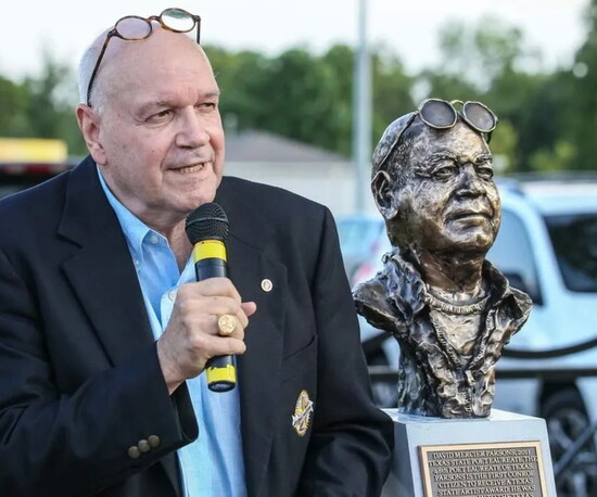 David Mercier Parsons, author and 2011 Texas Poet Laureate, stands beside his likeness, sculpted by Craig Campobella.