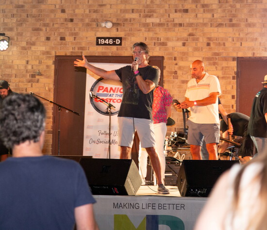 Club founder and president Larry Butler, a former board member now serving in an advisory role, speaks to RocktemberFest guests.