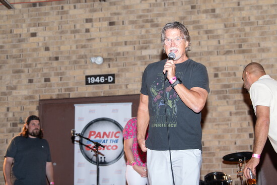 Club founder and president Larry Butler, a former board member now serving in an advisory role, speaks to RocktemberFest guests.