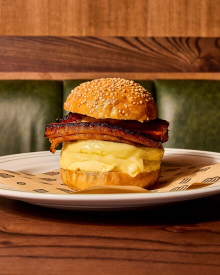 Bar Bludorn features brunch classics like Pastami Benedict and this Breakfast Sandwich made with eggs, gruyere, dijonaise, and bacon. Photo by Bethan Ochs. 