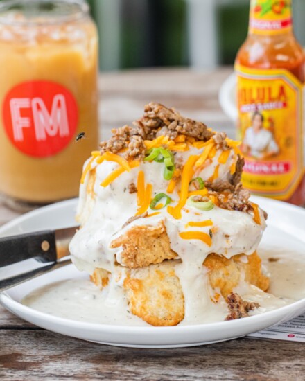 Take advantage of FM Kitchen & Bar indoor our outdoor seating option during brunch and hearty dishes like Chicken Fried Chicken Biscuit. Photo by Becca Wright