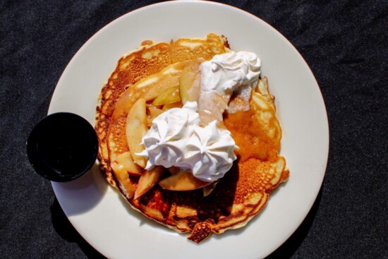 Mile Marker 158 Dockside's pecan pancakes topped with spiced apples served with The Long Pour