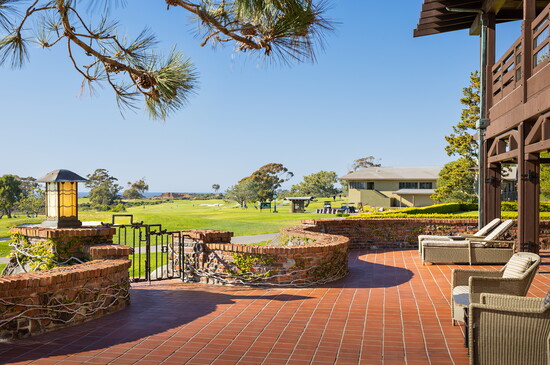 Guests of The Lodge enjoy curated golf packages and serene mornings with coffee and cliffside views.