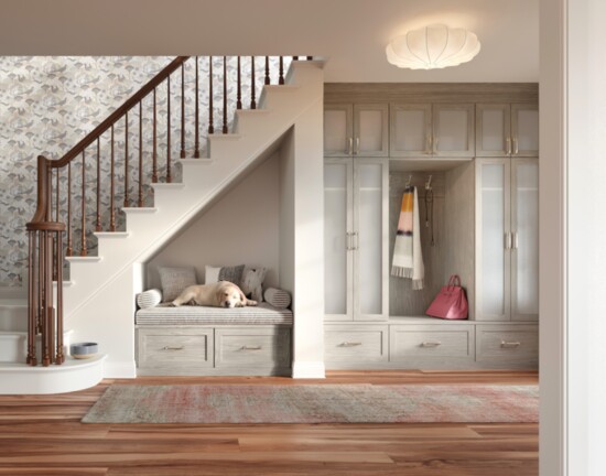 A hallway mudroom with a built-in bench doubles as a cozy spot for family pets.