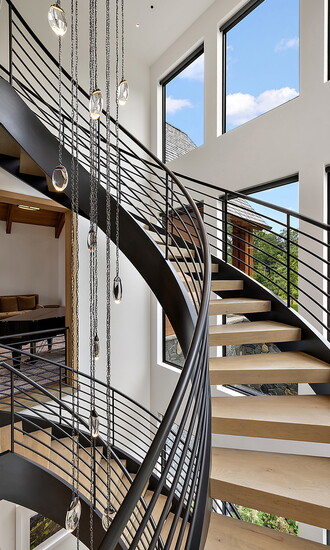 This massive steel staircase was completely re-engineered mid-build. Photo by Skyview Experts.