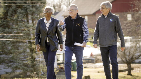 Rev. Paula Stewart, Larry Plum &  Earl Crossland walk the future site of Veterans Village behind Gaines UMC. 