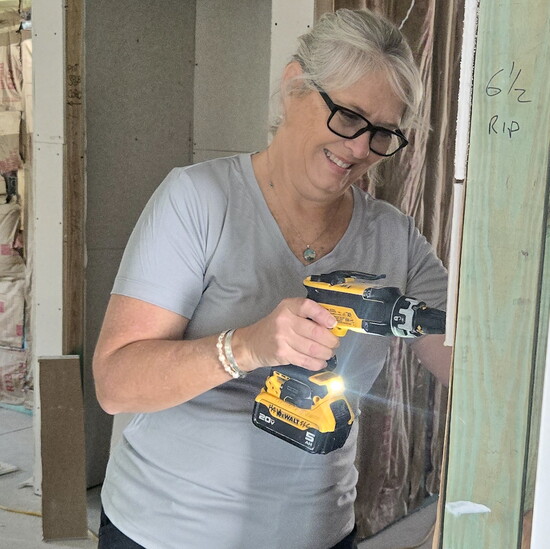 HHSSC Board President Liz Watts shows her construction skills at Women Build.