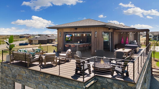 Rooftop goals: built-in bar, fire pit, hot tub, and views for days. Photo by Boxwood Photos.