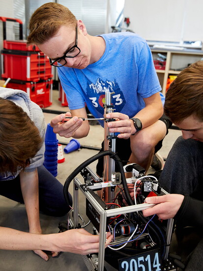 Severance High School student's Robotics Team work on their robot.