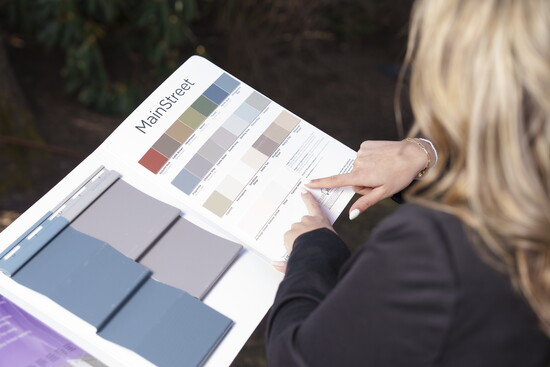 Close up of Rosa with a sample board