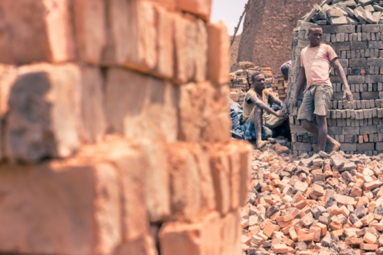 Brick makers in Gashora, Rwanda. These bricks are more durable than the mud bricks people usually use to build their homes.