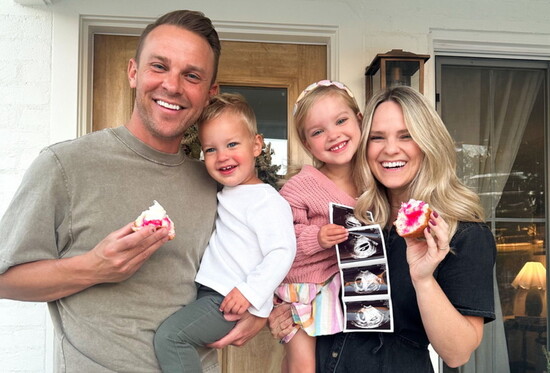 The big reveal: Identical twin girls.