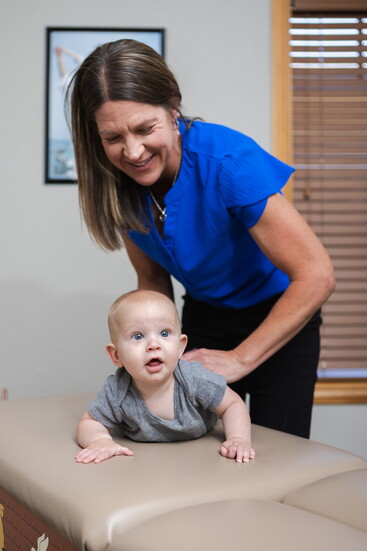 Waylon getting an infant adjustment by Dr. Patricia