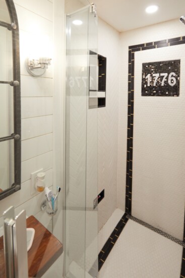 Annette's bathroom - the "1776" is inspired by tile markers on the walls of the NYC Subway.