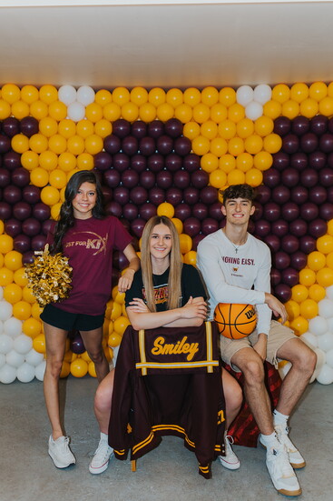 Allison’s bold backdrop reflects her talent and Wizard pride of (L-R) Tinsley Martinez-Castillo, Avery Smiley, and Madden Smiley. Photo by Photos by Diandra