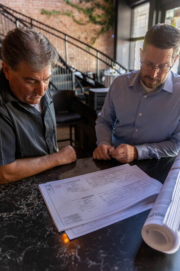 Carr (left) and Churchman. Photographed on location at Elliott's Steakhouse.