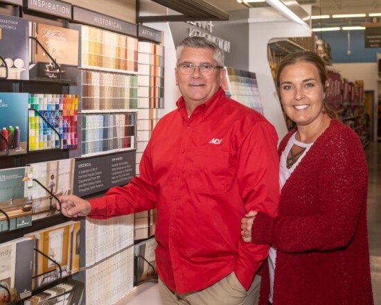 Hendersonville Ace Hardware owners Greg and Christa Yandell show off their large paint selection.