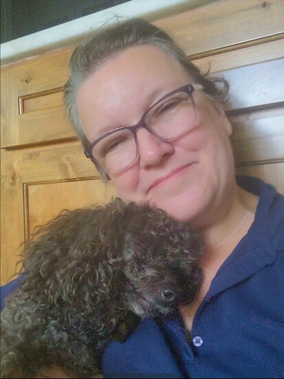 Traci Johnson with a four-legged client 