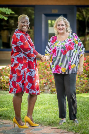 Kuma Roberts, Tulsa Chamber VP and Katherine Skorvaga, executive director of Dress for Success Tulsa, in bright and colorful summer fashions.