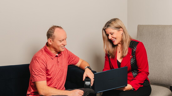 Sara consulting Dr. Tory on financial services.