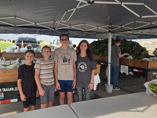 Simpson grandchildren help run the corn stand every summer.