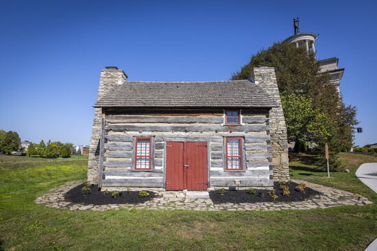 Monument Cabin stands near the bank of the Great Miami River on the historic grounds of Fort Hamilton.