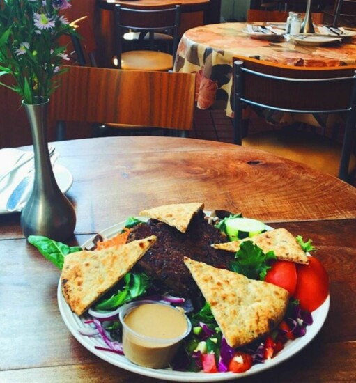 Black bean burger with garden salad and pita