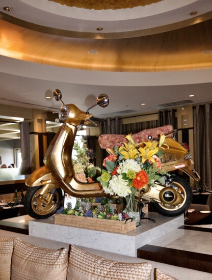 The gold Vespa in the main dining area