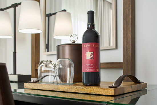 A bottle of Trinitas Cellars Wine awaits eveyone when they enter their room at The Meritahe Resort and Spa