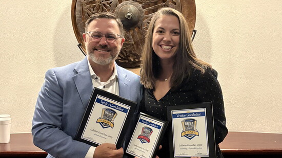 Steve Ledbetter and Callie W. Cowan of Ledbetter Cowan Law Group with their "Best of Venice" Awards.