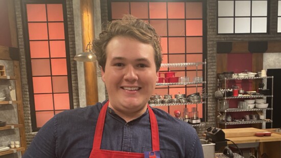Cameron displays the winning lobster risotto in the green room on set of Worst Cooks in America.