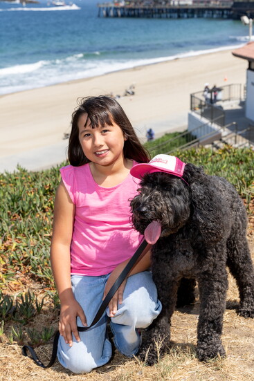This month’s Redondo Beach City Lifestyle cover model, Dakota, poses with his BFF Zigi—sporting the must-have Redondo Beach doggie trucker hat from Abbracci.