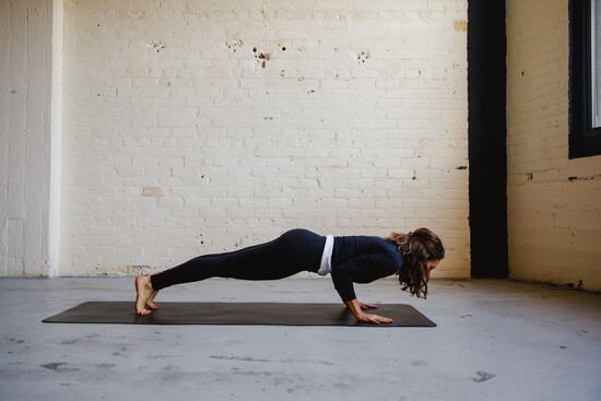 Low Plank (Chaturanga): Controlled fire. From high plank, bend elbows close to ribs and lower body in one long line. Builds: Arm, shoulder + chest strength.
