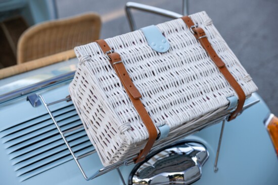 A rear mounted wicker picnic box. 