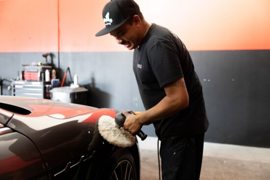 Sergio Garcia, Auto Paint Tech, buffing a freshly painted Maserati Ghibli. 