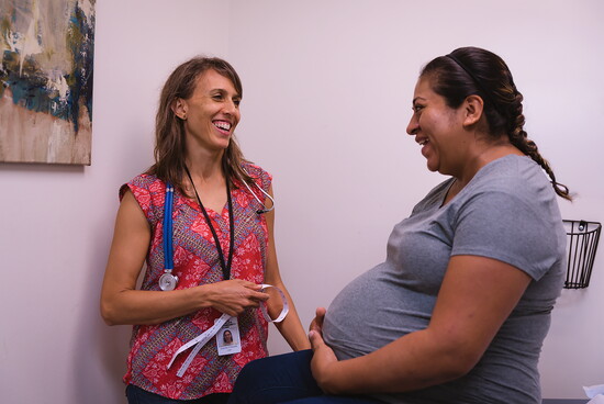 A mother-to-be being seen by one of People's OBGYNs.