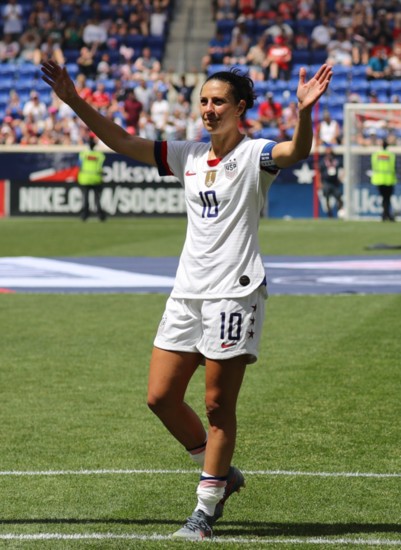 Carli thanks the fans as she walks off the field.