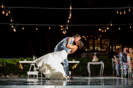 The bride and groom finish their first dance with a flourish.