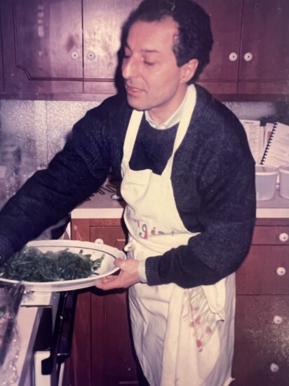 Carmine Sr. cooking at home