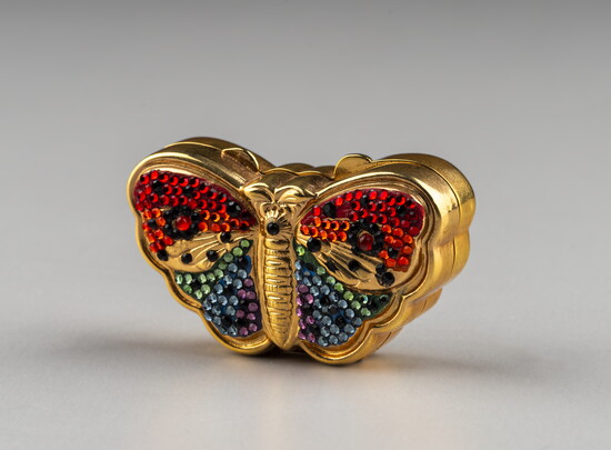 Judith Leiber (American, 1921 – 2018). Butterfly Pillbox, c. 1988, gold-plated brass, Swarovski crystals. Gift of the family of Vicki and Jim Mills. 2025.34.27.