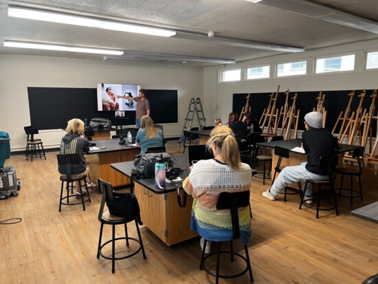 Photography instructor Adam Sheridan teaching "Intro to Photography"