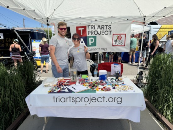 Board members Adam Sheridan and Jacque Ruff at the TAP booth at Ducky Derby