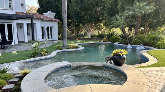 The redesigned pool includes new glass tile and water features.