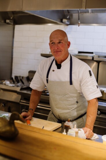 Chef Brian Lewis in the kitchen. Photo by EPG Creative.