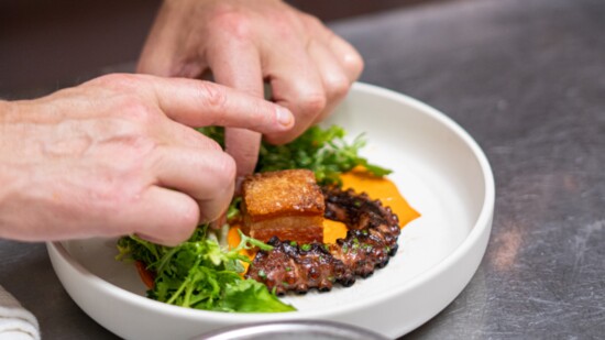 Plating a dish. Photo by EPG Creative.