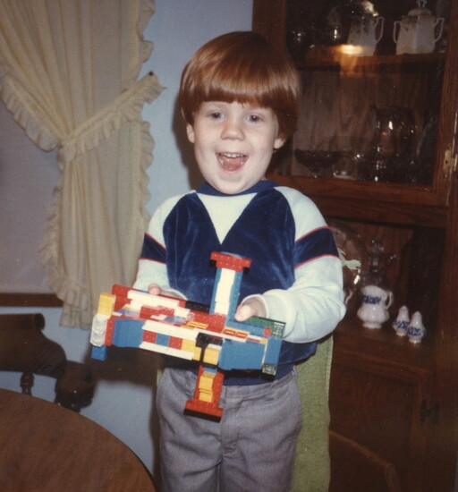 Byron, aged three, with one of his first designs — a LEGO airplane. 