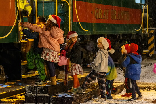 Children board the North Pole Express at Cavanna's Farm. 