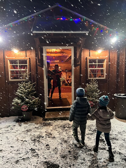 Visitors arrive at one of the Santa cabins along the North Pole Express at Cavanna's Farm.